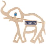 NIXON STYLIZED BRASS ELEPHANT PIN BACK BADGE WITH BLUE RHINESTONE EYE.