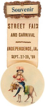 IOWA 1899 SOUVENIR RIBBON BADGE FOR STREET FAIR AND CARNIVAL W/RISQUE LADY ON DONKEY.