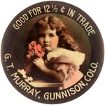 POCKET MIRROR FOR G.T. MURRAY, GUNNISSON, CO GOOD FOR 12 1/2¢ IN TRADE SHOWING GIRL W/FLOWERS.