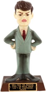 KENNEDY CARICATURE "THE WHITE HOUSE CAN'T BE CHARTREUSE JACKIE" CERAMIC FIGURE.