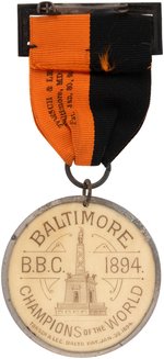 1894 BALTIMORE ORIOLES "CHAMPIONS OF THE WORLD" BADGE W/CELLULOID MEDALLION FEATURING 7 HOF'ERS.