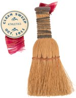 1911 PHILADELPHIA ATHLETICS BUTTON PREDICTING WORLD SERIES "CLEAN SWEEP" WITH WHISK BROOM ATTACHMENT.