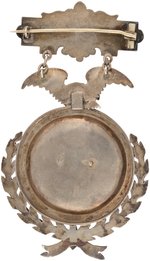 1894 (WRESTLING) "INTERNATIONAL TOURNAMENT HEAVYWEIGHT CHAMPION MAR. 19" SILVER AWARD BADGE.