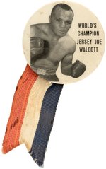 C. 1952 WORLD'S CHAMPION JERSEY JOE WOLCOTT BUTTON WITH RIBBON ACCENT.