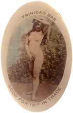 OVAL POCKET MIRROR "TRINIDAD BAR GOOD FOR 12 1/2¢ IN TRADE" W/REAL PHOTO NUDE POSED OUTDOORS.