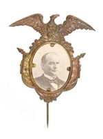 McKINLEY LARGE BRASS SHELL STICKPIN WITH CARDBOARD PHOTO.