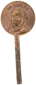 "McKINLEY" EMBOSSED BRASS WATER SQUIRTING LAPEL DEVICE.