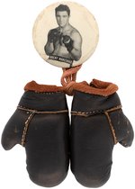 C. 1952 "ROCKY MARCIANO" BUTTON W/HIS NAME ON WAISTBAND AND LARGE SUSPENDED BOXING GLOVES.
