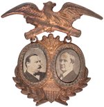 CLEVELAND & HENDRICKS 1884 CROSSED CANNONS BRASS SHELL JUGATE BADGE.