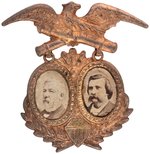 BLAINE & LOGAN 1884 CROSSED CANNONS BRASS SHELL JUGATE BADGE.