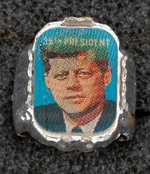 VENDING MACHINE INSERT PAPER PLUS C. 1963 MEMORIAL KENNEDY FLICKER RING.