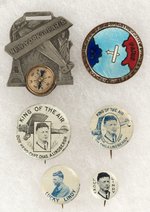 LINDBERGH 1927 NEW YORK TO PARIS WATCH FOB, ENAMEL BADGE AND FOUR LITHO BUTTONS.