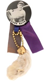 1940s BABE RUTH (HOF) PM10 STADIUM BUTTON WITH RIBBONS AND RABBIT'S FOOT HANGER.