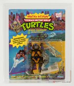 TEENAGE MUTANT NINJA TURTLES - WACKY ACTION SEWER-SWIMMIN' DONATELLO AFA 60 Y-EX.