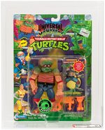 UNIVERSAL STUDIOS MONSTERS TEENAGE MUTANT NINJA TURTLES - THE MUTANT RAPHAEL AFA 80 NM (ORANGE ACCESSORIES & CARD).