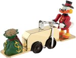 UNCLE SCROOGE "GOLD MOBILE" HAND CAR BOXED MOTORIZED TOY.