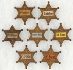 C. 1900 BASEBALL TEAM POSITIONS 6 POINT STAR METAL BADGES 7 OF POSSIBLE 9 IN SET.