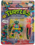 TEENAGE MUTANT NINJA TURTLES: DISGUISED TURTLES - MIKE, THE SEWER SURFER SERIES 3/44 BACK CARDED ACTION FIGURE.