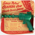 SPACE PATROL CLICKER (SMOKE) GUN ON CARD.