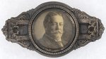 TAFT PORTAIT BUTTON IN ORNATE BRASS SHELL BADGE.