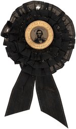 LINCOLN 1864 "FOR PRESIDENT" FERROTYPE CAMPAIGN BADGE PINNED TO MOURNING RIBBON.