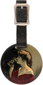 CELLULOID WATCH FOB "THE OZARKA GIRL" C. 1910 FROM OKLAHOMA CITY'S WESTERN MINERAL WATER CO.