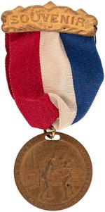 1923 SOUVENIR RIBBON BADGE W/BRASS MEDALLION FOR "CHAMPIONSHIP DEMPSEY-GIBBONS-SHELBY, MONT. JULY 4, 1923/OIL CITY".