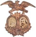 BLAINE & LOGAN 1884 CROSSED CANNONS BRASS SHELL JUGATE BADGE.