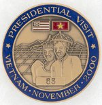 CLINTON TRIP TO VIETNAM NOV. 16, 2000 SERIALLY NUMBERED AIR FORCE ONE SOUVENIR MEDAL.