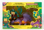 TEENAGE MUTANT NINJA TURTLES CAVE-TURTLE 2-PACK MIKE W/SILLY STEGOSAURUS AFA 80 NM.