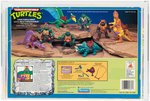 TEENAGE MUTANT NINJA TURTLES CAVE-TURTLE 2-PACK MIKE W/SILLY STEGOSAURUS AFA 80 NM.