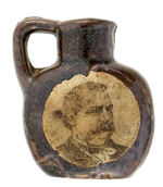 CERAMIC 1892 WHISKEY JUG WITH CLEVELAND & STEVENSON PAPER PORTRAITS.