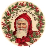 SANTA IN RED HOOD SURROUNDED BY HOLLY EARLY 1900s WANAMAKER'S BUTTON.