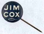 "JIM COX" BLUE AND WHITE CELLULOID NAME BUTTON.