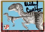 MICHAEL CRICHTON SIGNED JURASSIC PARK VELOCIRAPTOR CARD.