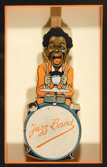 "JAZZ BAND" DRUMMER NOISE MAKER FRAMED DISPLAY.