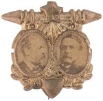 GARFIELD & ARTHUR 1880 CAMPAIGN BRASS SHELL JUGATE BADGE.