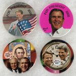 BUSH, GORE & KERRY QUARTET OF 2000 & 2004 CAMPAIGN BUTTONS W/ART BY DAVID RUSSELL.