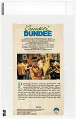 CROCODILE DUNDEE VHS (1987) IGS BOX 7.5 NM SEAL 7.5 NM (ENGLISH COVER/75th PARAMOUNT/SIDE PHV WM/BLACK TAB/NO UPC).