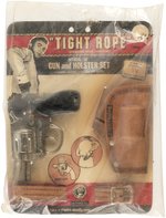 TIGHT ROPE DELUXE GUN AND HOLSTER SET SEALED ON CARD.