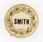 TINY AL SMITH FLORAL DESIGN NAME BUTTON.