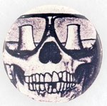 ANTI-NUCLEAR BUTTON W/ SKULL'S SUNGLASSES REFLECTING VIEW OF TWIN NUCLEAR COOLING TOWERS FROM 1982 AND LEVIN COLLECTION.