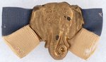 HOOVER & CURTIS 1928 BRASS SHELL ELEPHANT BADGE.