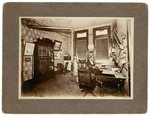 BRYAN & STEVENSON ORIGINAL PHOTO OF OFFICE INTERIOR FEATURING 1900 JUGATE POSTER.