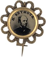 H. SEYMOUR FERROTYPE IN ORNATE BRASS SHELL PIN-BACK BADGE.