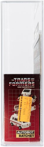 TRANSFORMERS (1984) SERIES 1 CAR - RATCHET AFA 85 NM+ (NO RUBSIGN/HAS RED CROSS).