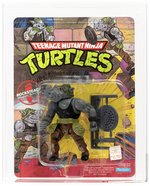 TEENAGE MUTANT NINJA TURTLES (1988) - ROCKSTEADY SERIES 1/10 BACK AFA 80 NM.