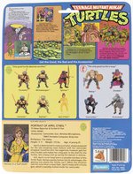 TEENAGE MUTANT NINJA TURTLES (1988) - APRIL O'NEIL (NO STRIPE VARIETY) SERIES 1/10 BACK ACTION FIGURE ON CARD.