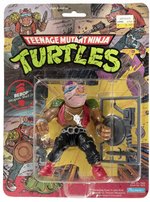 TEENAGE MUTANT NINJA TURTLES (1988) - BEBOP SERIES 1/10 BACK ACTION FIGURE ON CARD.