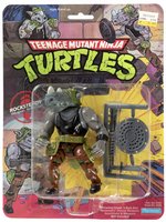 TEENAGE MUTANT NINJA TURTLES (1988) - ROCKSTEADY SERIES 1/10 BACK ACTION FIGURE ON CARD.